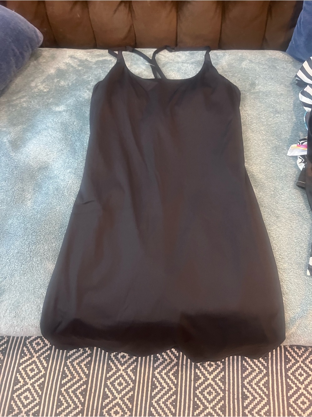 Women’s Black knee length dress with built in shorts.